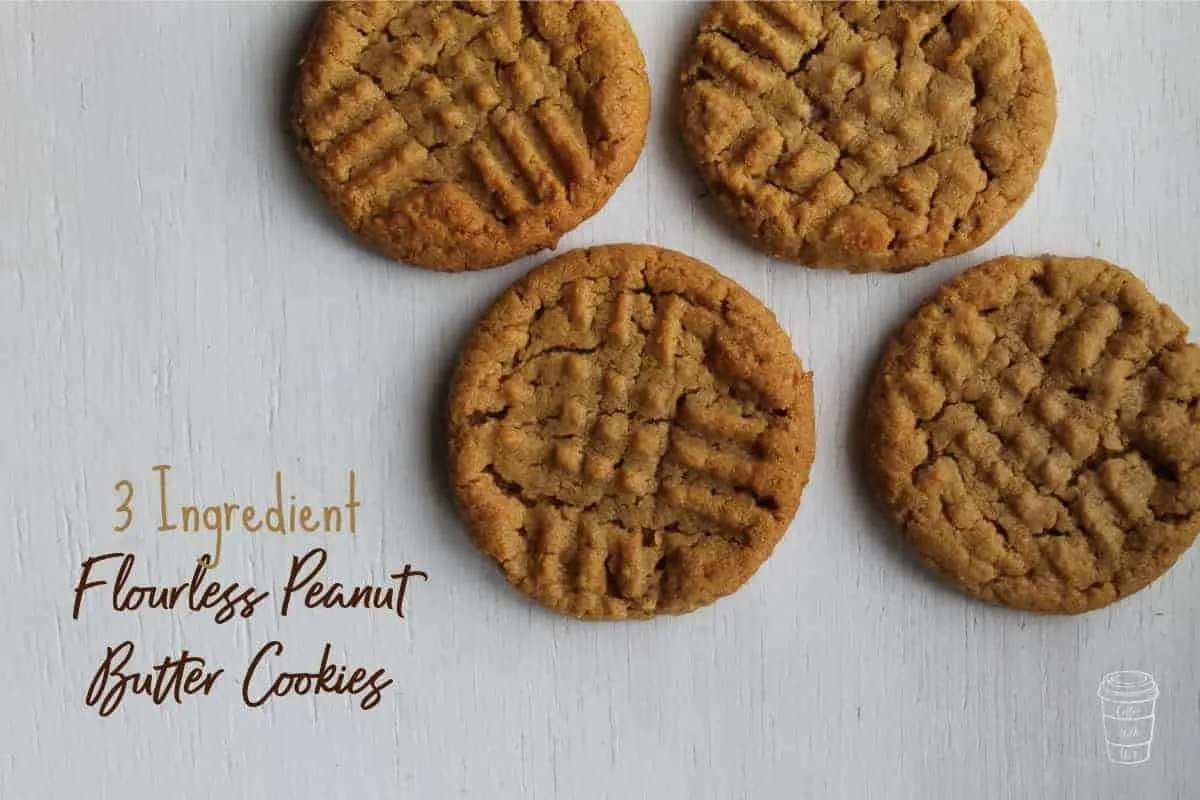 Four pieces of no egg 3-ingredient peanut butter cookies with white background.