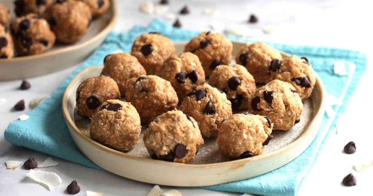 No-bake peanut butter balls with chocolate chips on a plate.