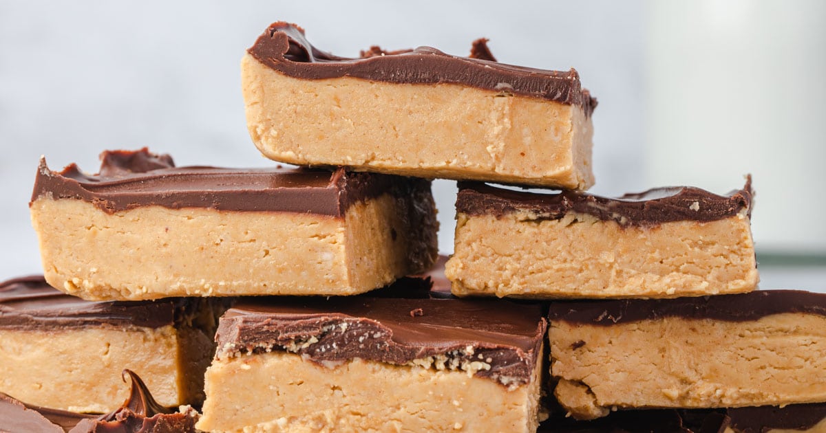 Close up photo of buckeye peanut butter bars in a stack.
