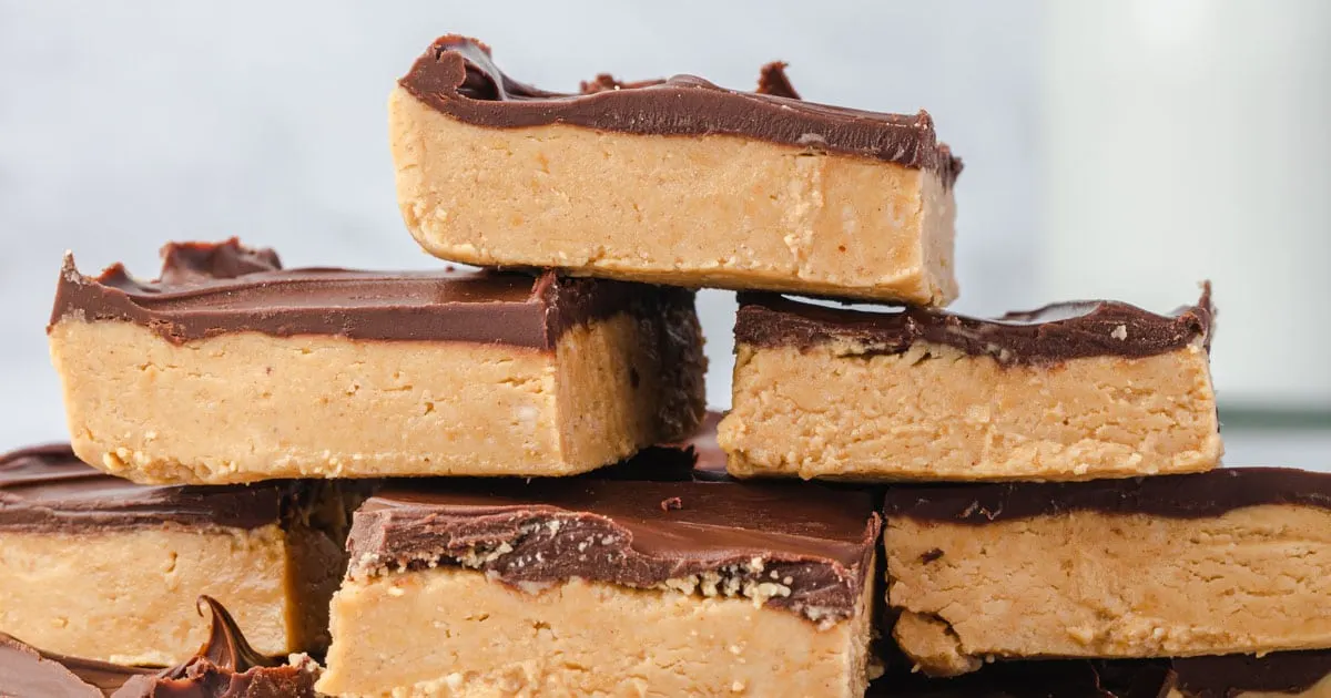 Close up photo of buckeye peanut butter bars in a stack.