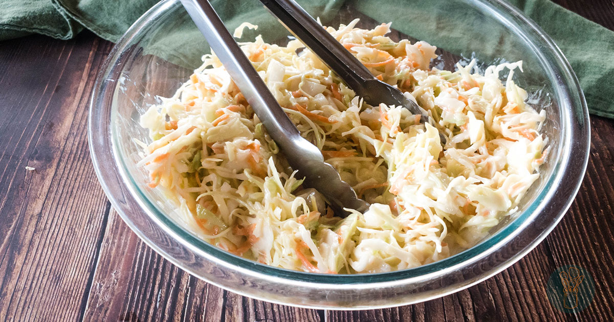 A picture of Popeyes coleslaw copycat recipe in glass bowl.