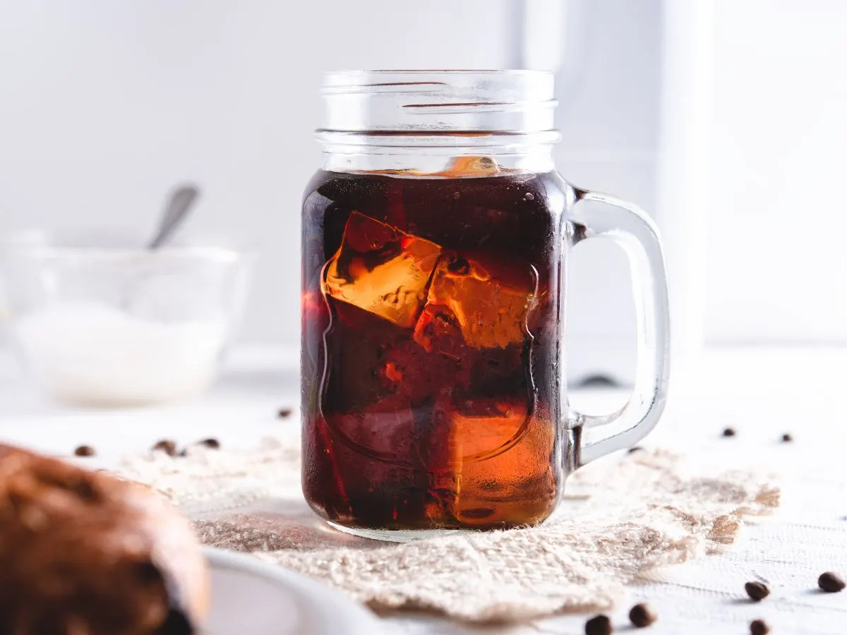 Cold brew coffee in mug with ice cubes.