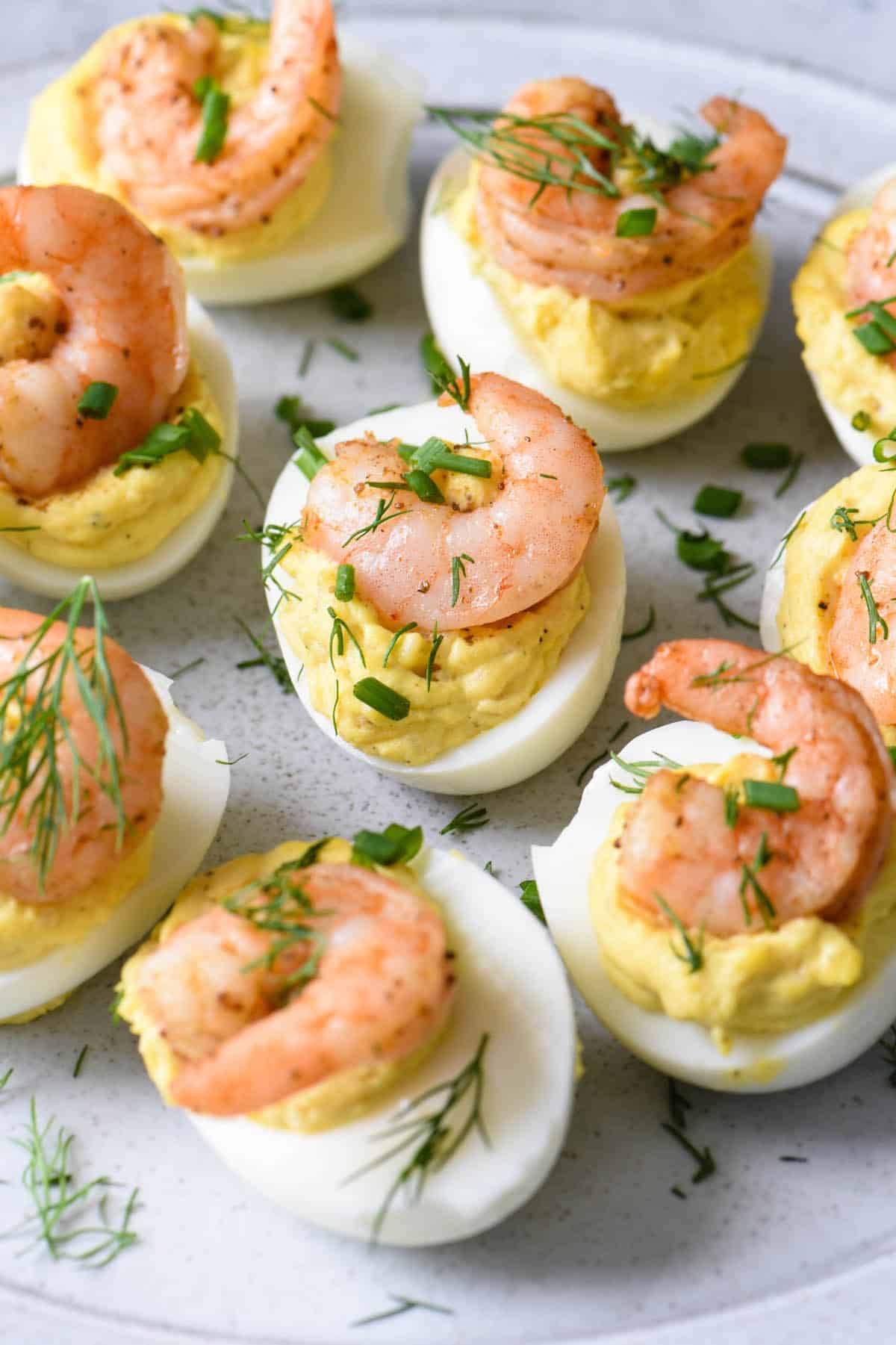 Deviled eggs with shrimp and dill.