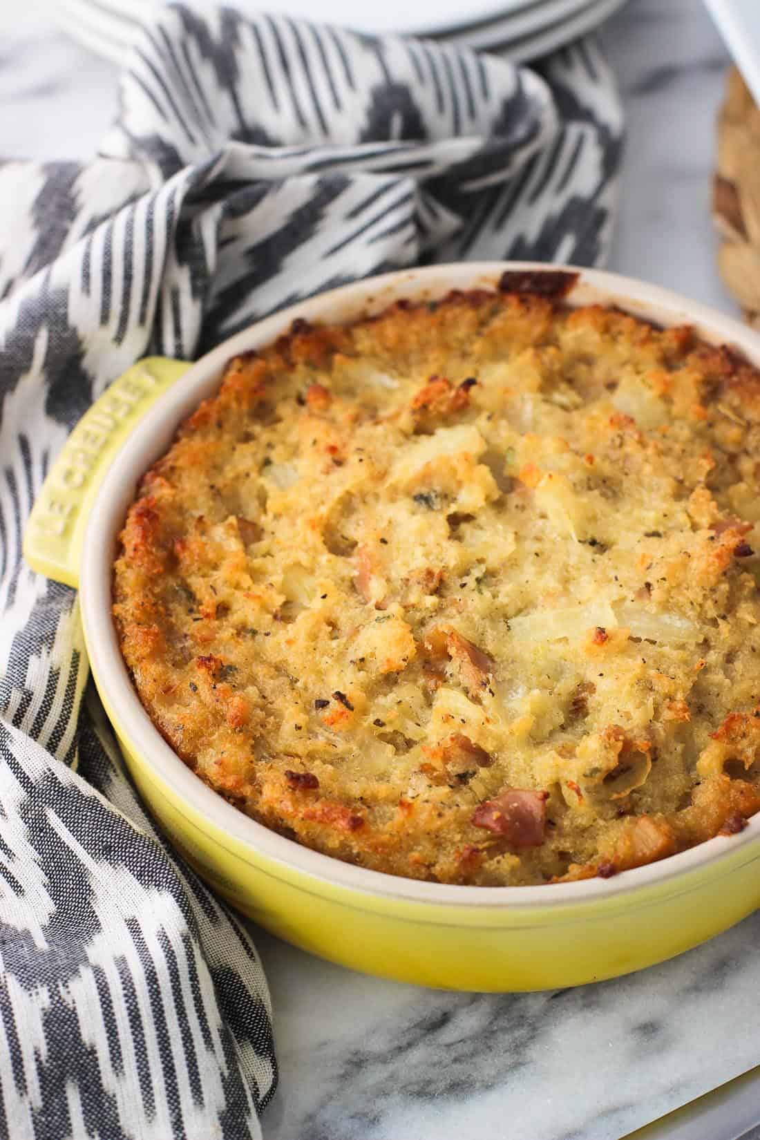 A dish of baked clam dip on a table.