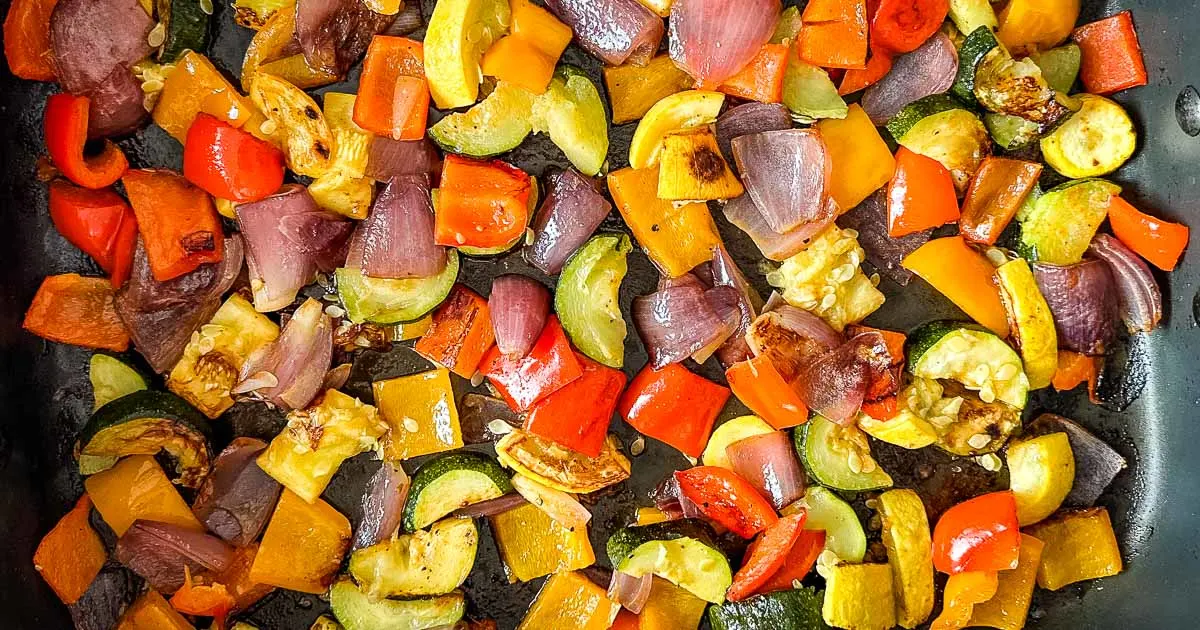 A pan full of roasted vegetables in a skillet.