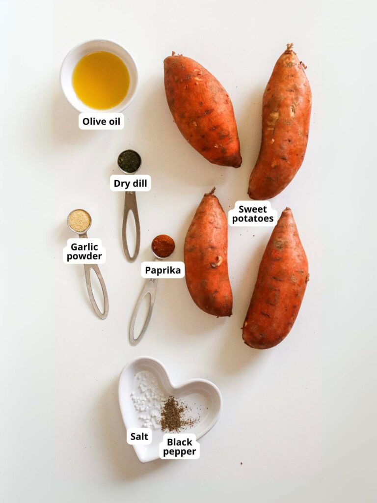 Ingredients for sweet potato fries on a light colored surface.