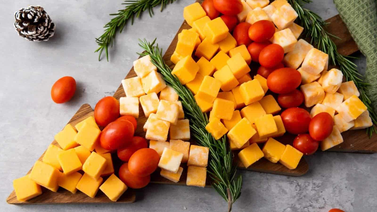 Christmas tree cheese platter on a light colored surface.