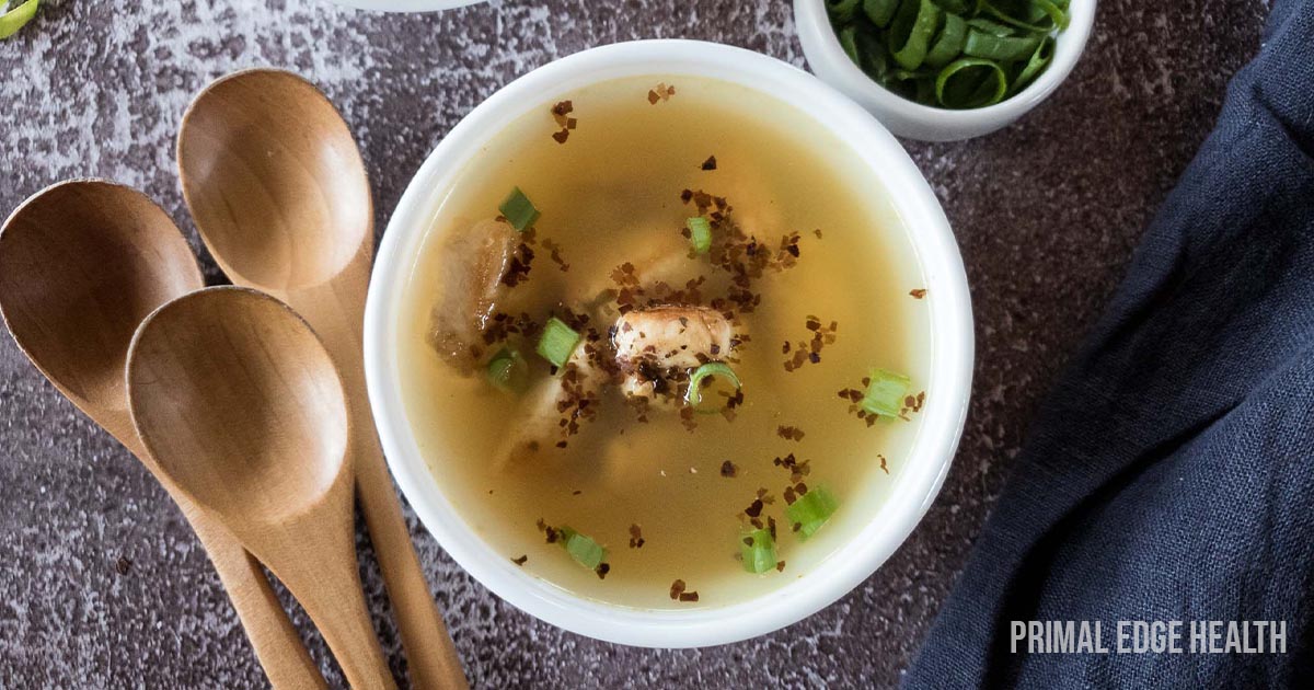 Chicken Miso Soup with seaweed and green onion garnish in a white soup bowl.