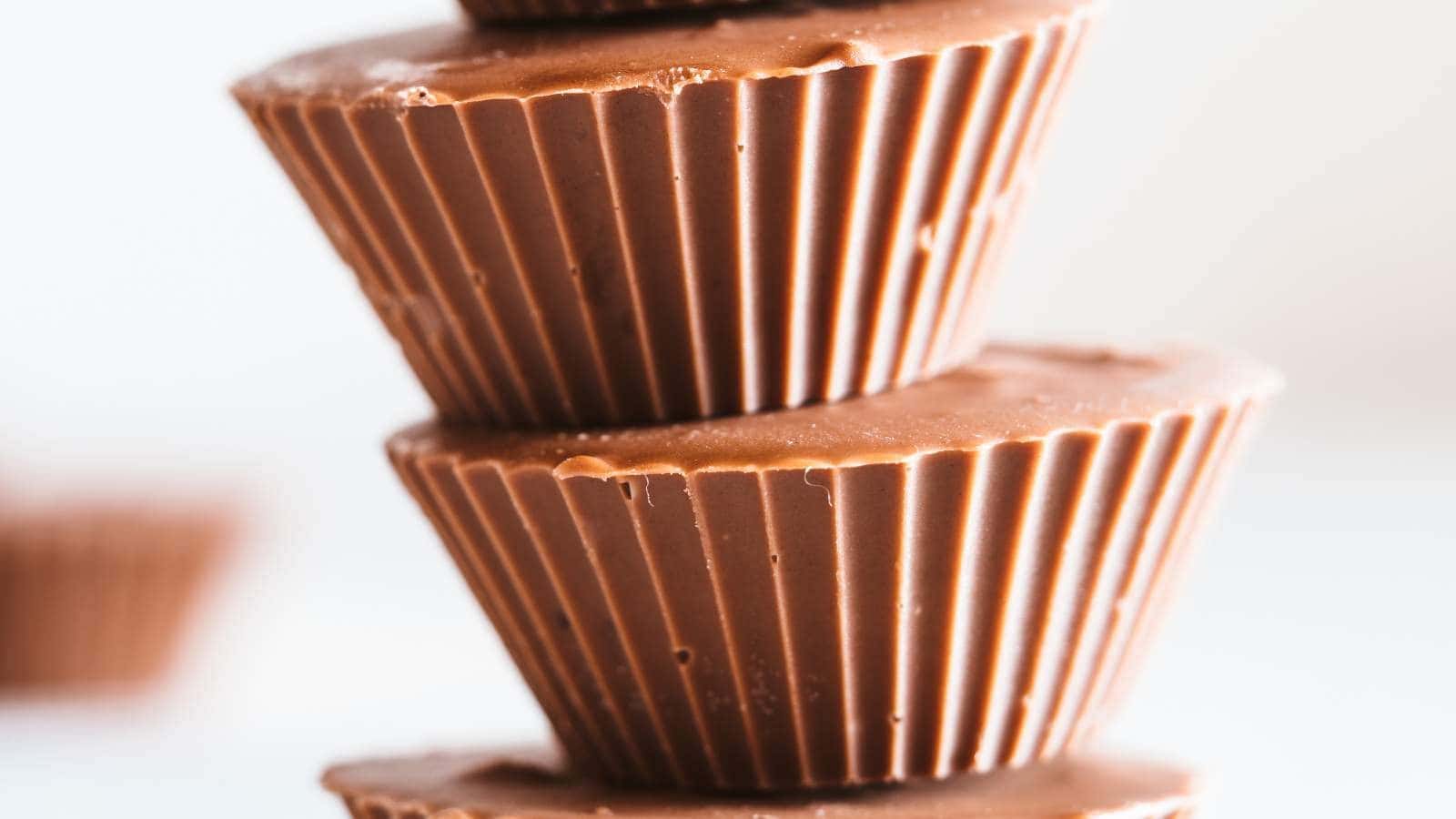 Close up of a stack of peanut butter cups with blurred background.