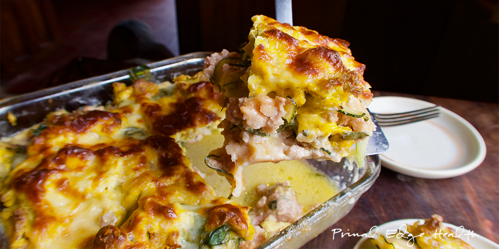 Breakfast lasagna being served at table.