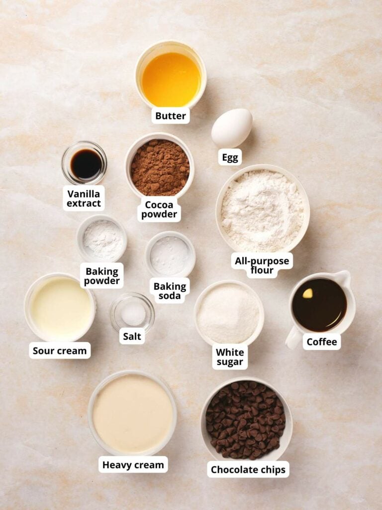 Ingredients for chocolate fudge cake laid out on a surface.