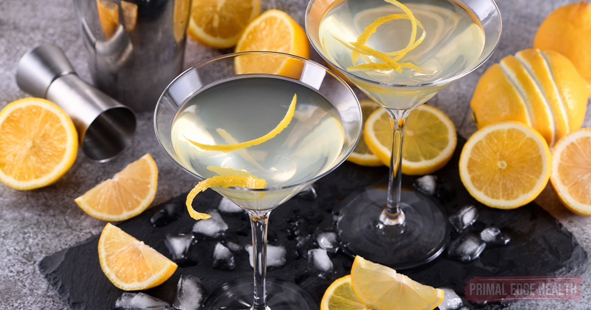 Two martini glasses filled with a lemon drop martini.