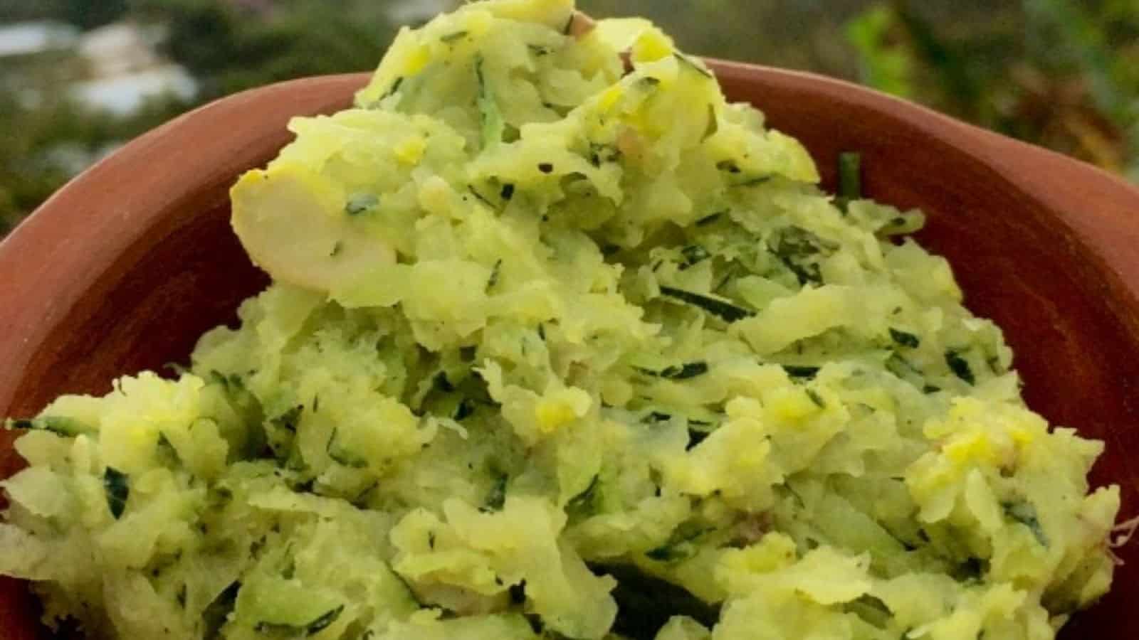 Zucchini butter in a small terracotta bowl.